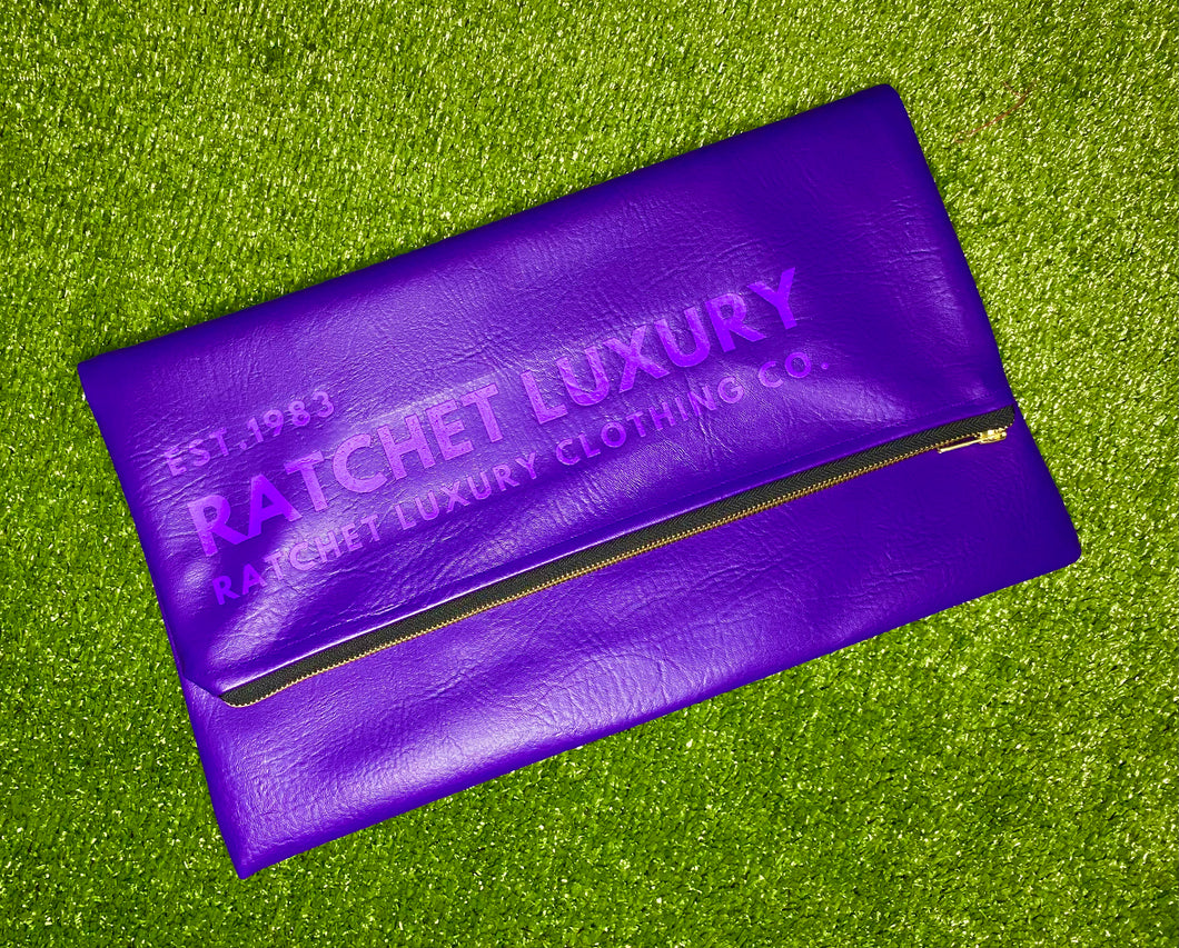 SIGNATURE FOLD OVER OVERSIZED CLUTCH - VIOLET