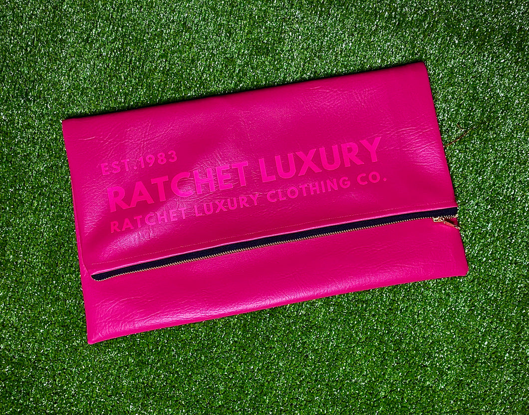 SIGNATURE FOLD OVER OVERSIZED CLUTCH - MAGENTA